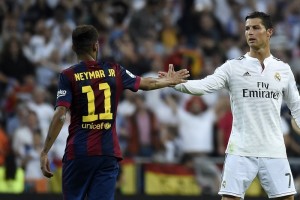 Barcelona's Brazilian forward Neymar da Silva Santos Junior (L) congratulates Real Madrid's Portuguese forward Cristiano Ronaldo on winning after the Spanish league "Clasico" football match Real Madrid CF vs FC Barcelona at the Santiago Bernabeu stadium in Madrid on October 25, 2014. Real Madrid won the match 3-1.  AFP PHOTO / GERARD JULIEN        (Photo credit should read GERARD JULIEN/AFP/Getty Images)